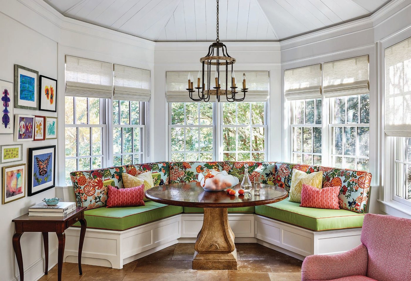 The sunroom-kids’ den is a bright example of brilliant fabrics complementing family art. PHOTOGRAPHED BY STACY ZARIN GOLDBERG