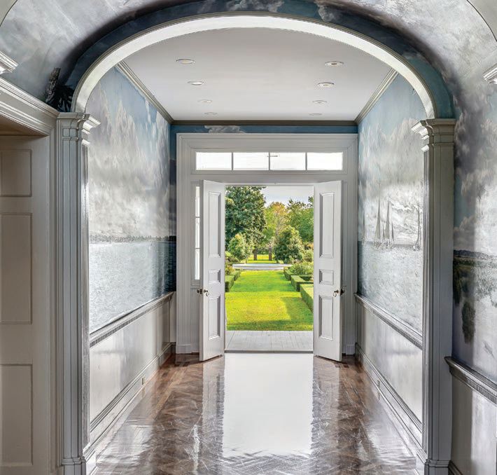 A bright and polished entrance hallway to the mansion PHOTO COURTESY OF LONG & FOSTER