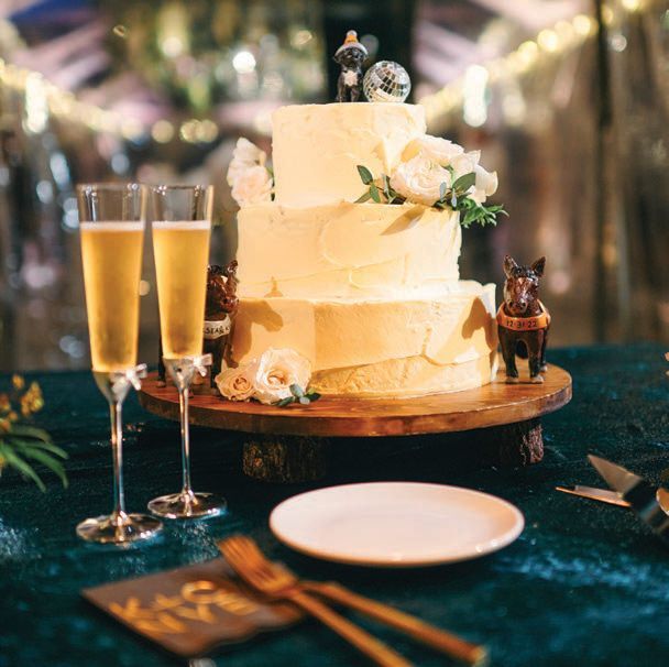 The cake by Lindwoods Catering showcased the couple’s beloved pooches PHOTO BY ELI TURNER