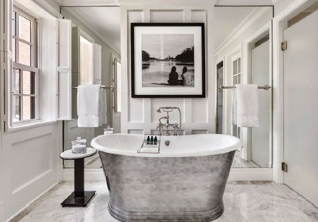 A deep-soaking tub and rainforest shower await on the top floor. PHOTO COURTESY OF ROSEWOOD WASHINGTON, DC