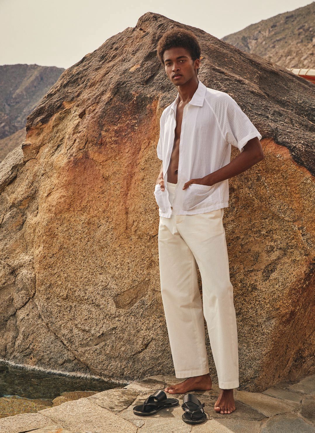 The seersucker Playa shirt in white, Japanese relaxed fit Selvedge chino in white, and Tuscan leather thong cross sandals in black PHOTO COURTESY OF TODD SNYDER
