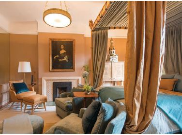 Eclectic suites are graced with fireplaces and four-poster beds dressed in rich textiles. PHOTO COURTESY OF THE IVY