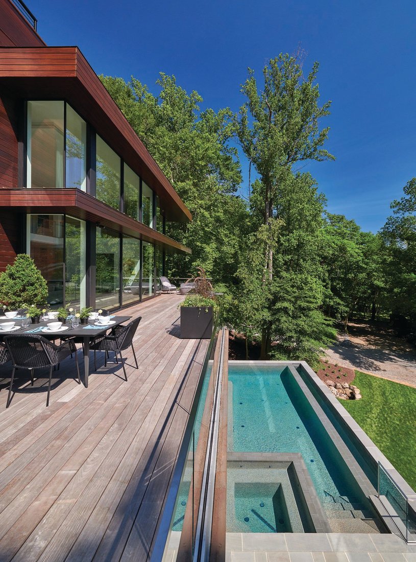 A gorgeous deck overlooks 3 acres that slope to the Potomac River. PHOTOGRAPHED BY ANICE HOACHLANDER