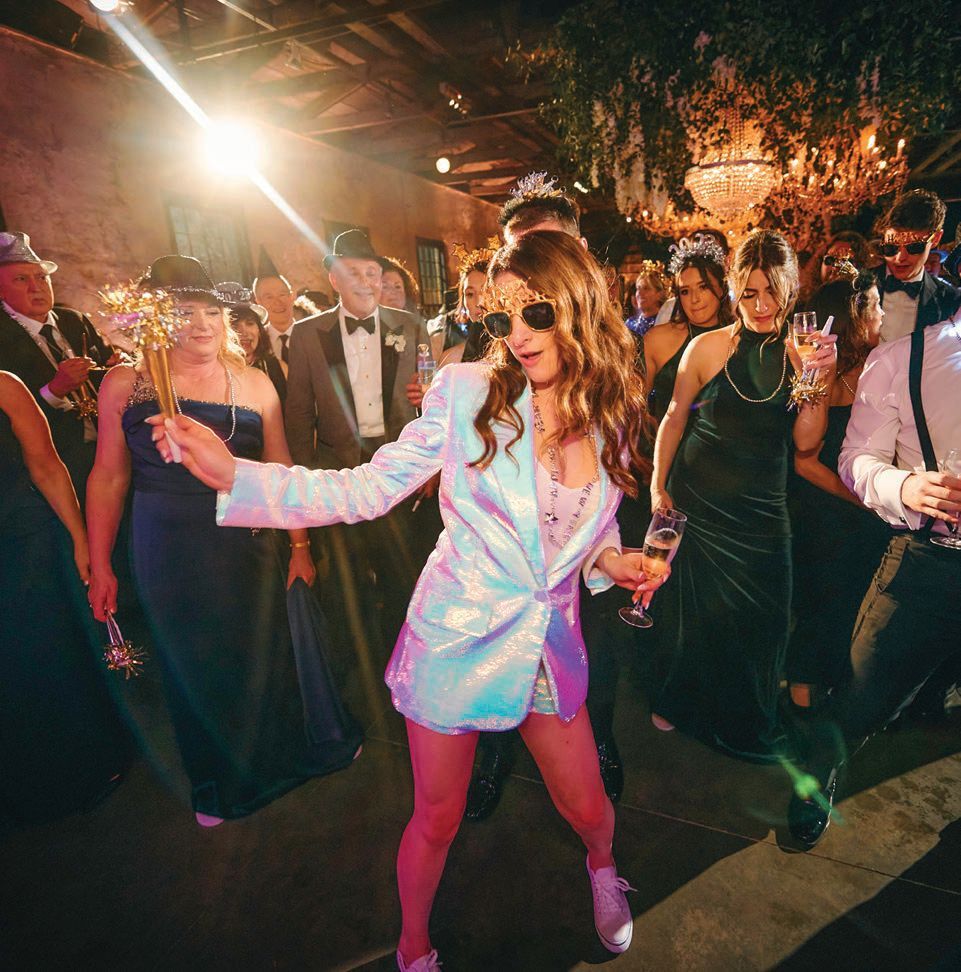 The bride changed into a sparkling suit by Nadine Merabi for the New Year’s Eve reception PHOTO BY ELI TURNER